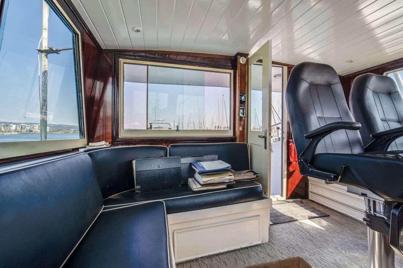 a room with a couch and a chair aboard SEA WOLF Yacht for Sale