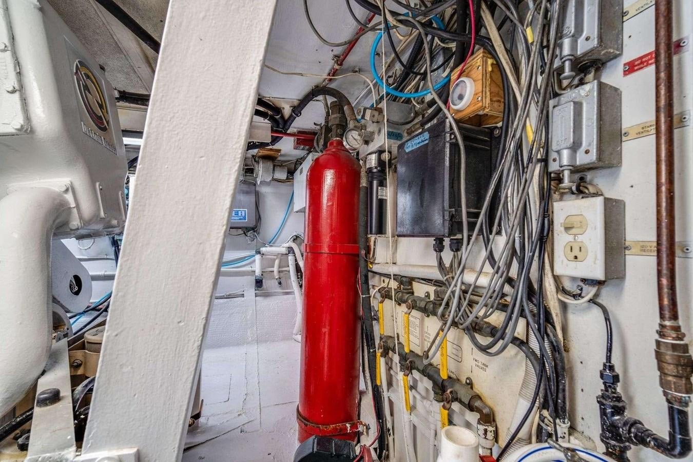 a red pipe in a white room aboard SEA WOLF Yacht for Sale