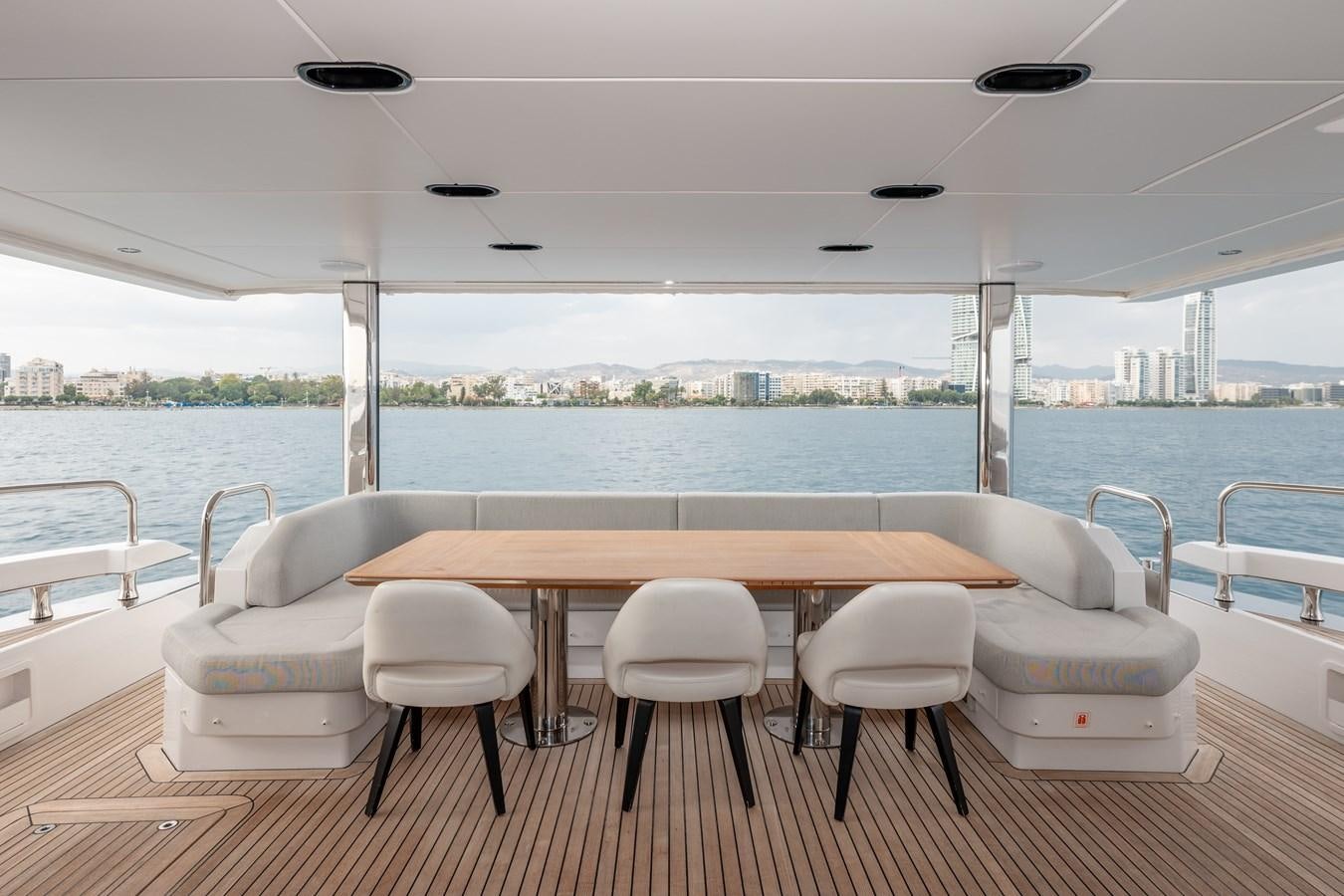 a table and chairs on a boat aboard CLOUDY BAY Yacht for Sale