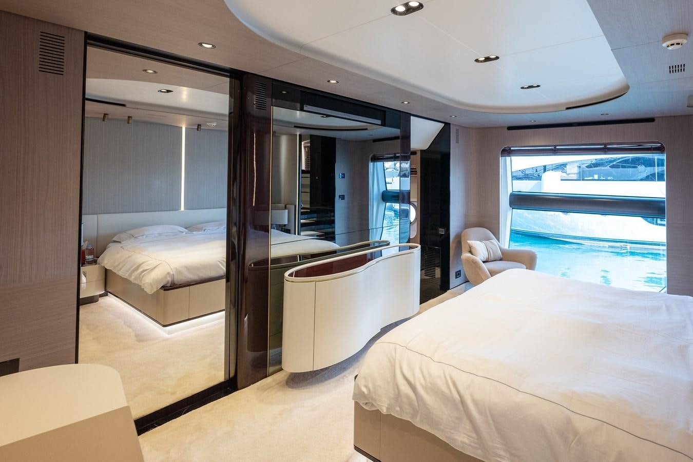 a room with a bed and a desk aboard CLOUDY BAY Yacht for Sale
