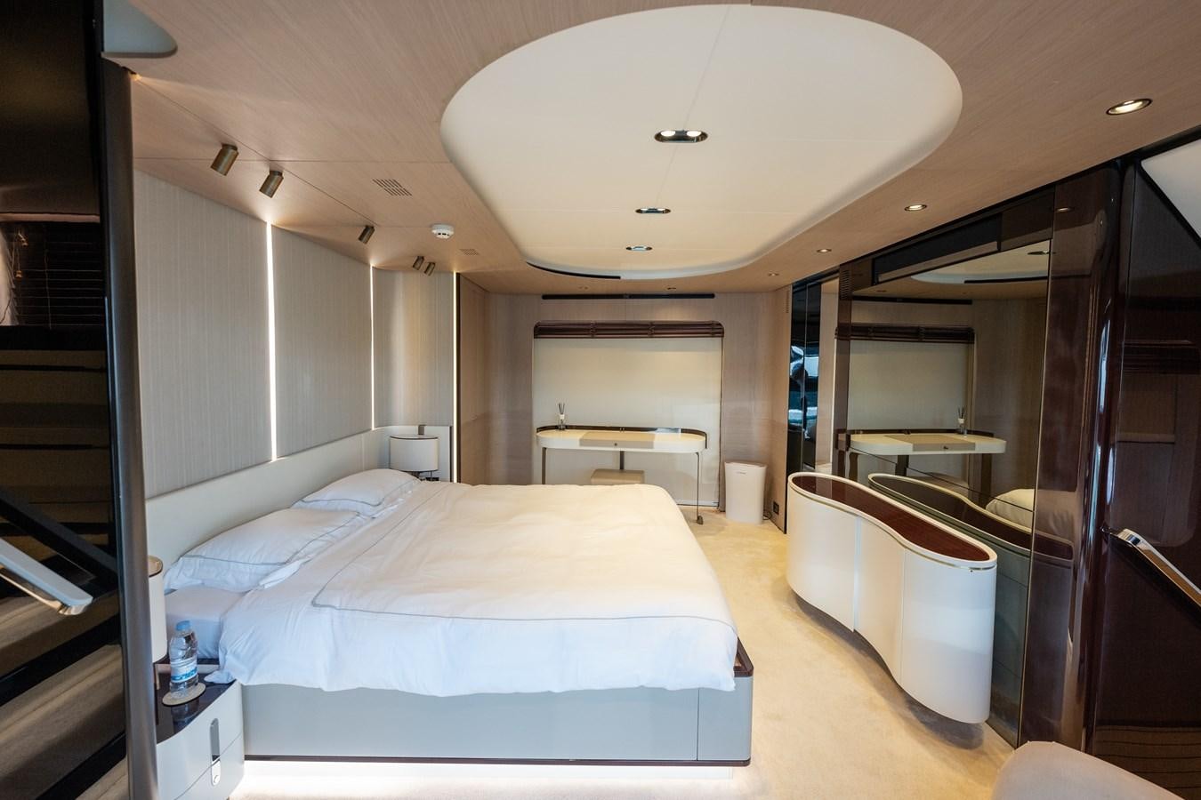 a room with a bed and a table aboard CLOUDY BAY Yacht for Sale