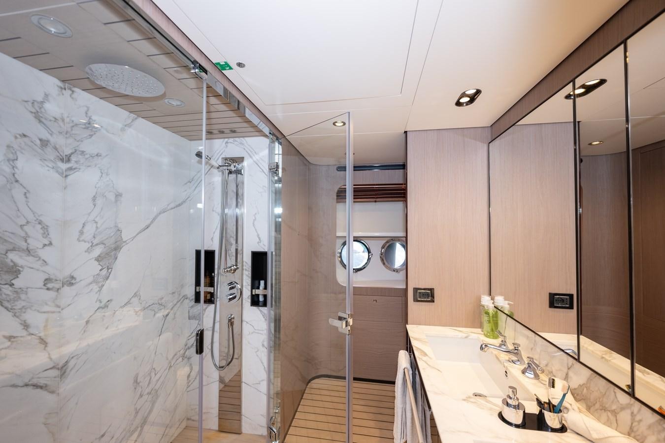a bathroom with a shower and sink aboard CLOUDY BAY Yacht for Sale