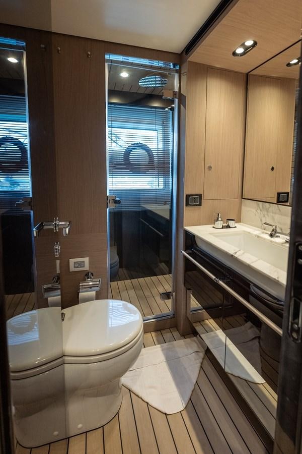 a bathroom with a glass shower door aboard CLOUDY BAY Yacht for Sale