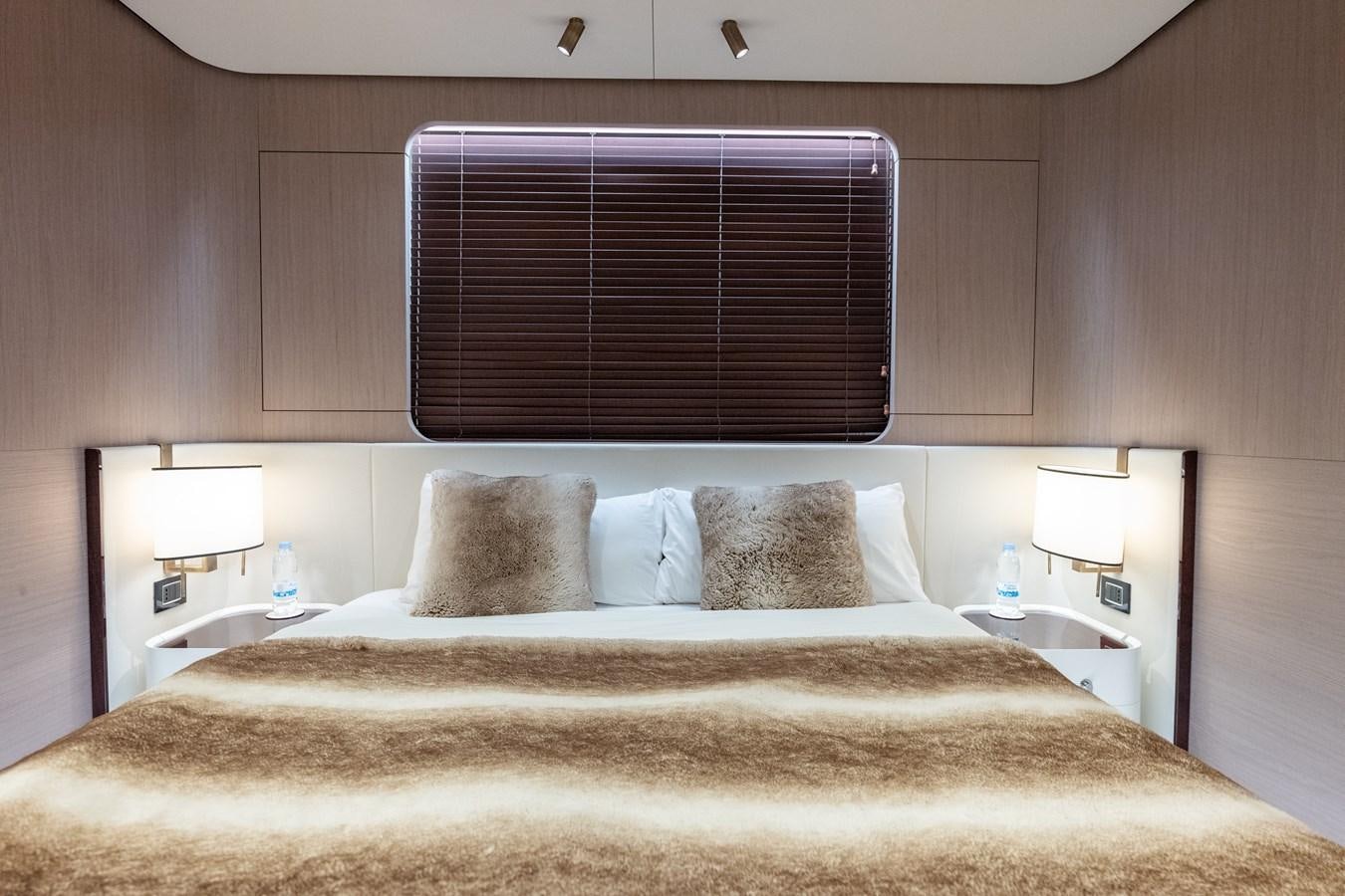 a bed with pillows aboard CLOUDY BAY Yacht for Sale