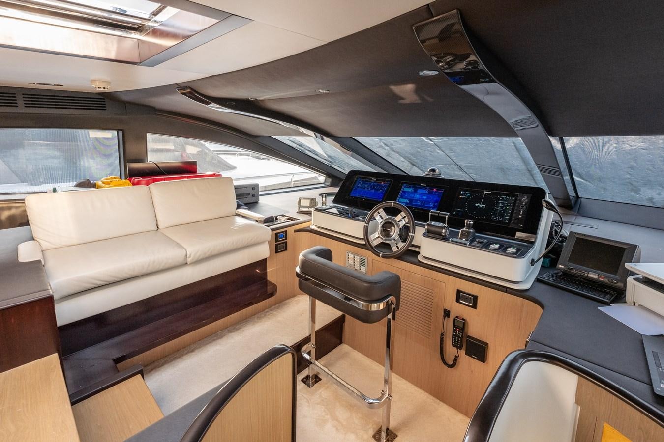 a car with a desk and a couch aboard CLOUDY BAY Yacht for Sale