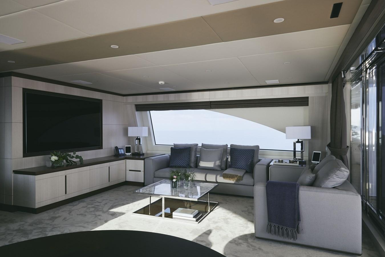 a living room with a large screen aboard BAMBOO Yacht for Sale