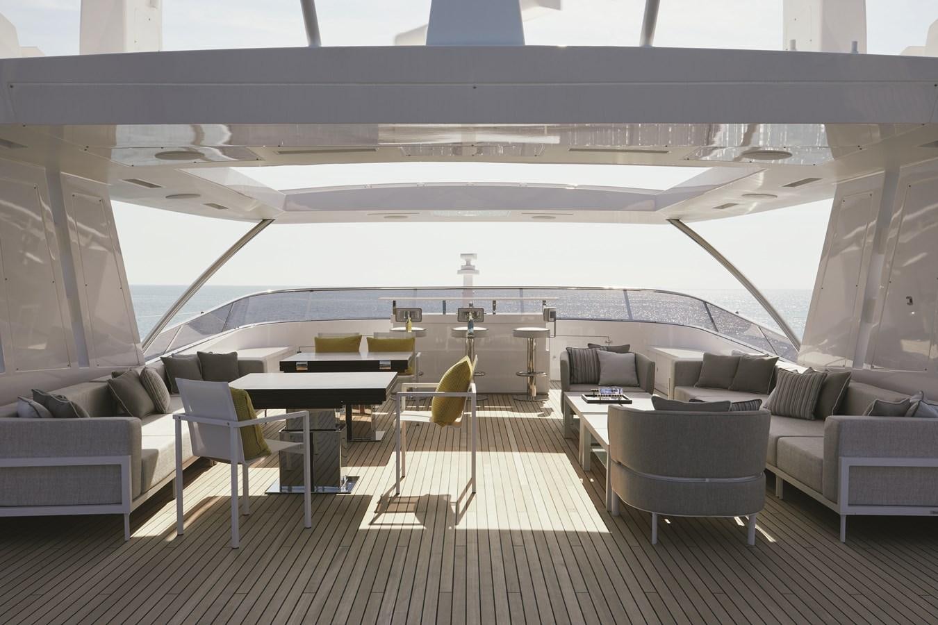 a room with couches and a table aboard BAMBOO Yacht for Sale
