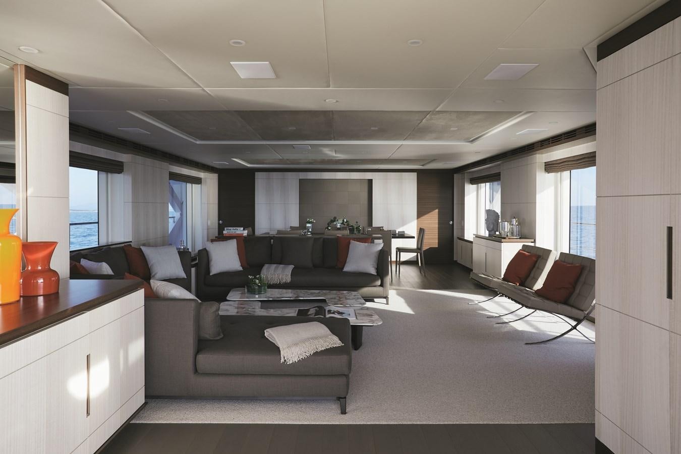a living room with a couch and a coffee table aboard BAMBOO Yacht for Sale
