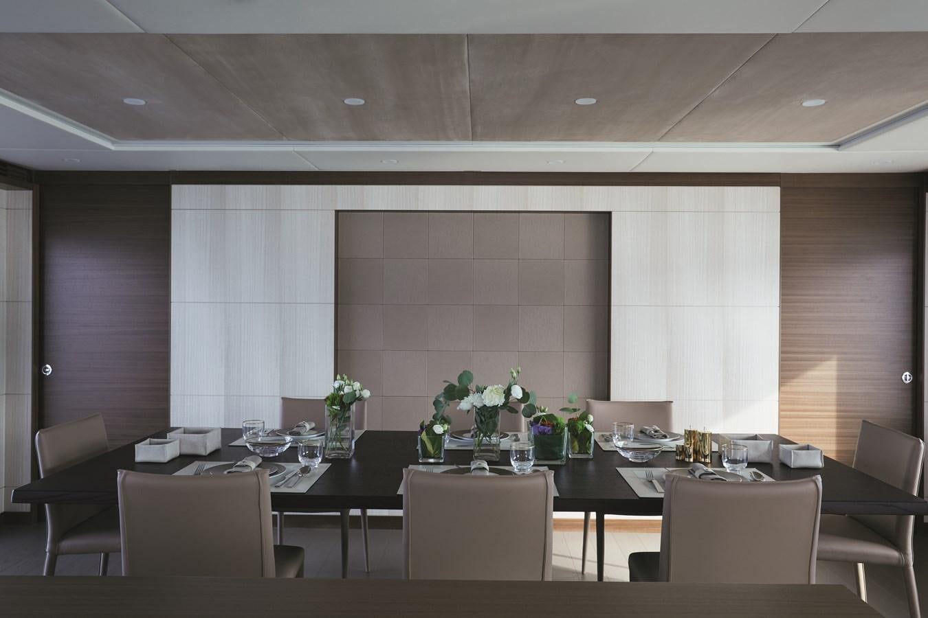 a large room with a table and chairs aboard BAMBOO Yacht for Sale