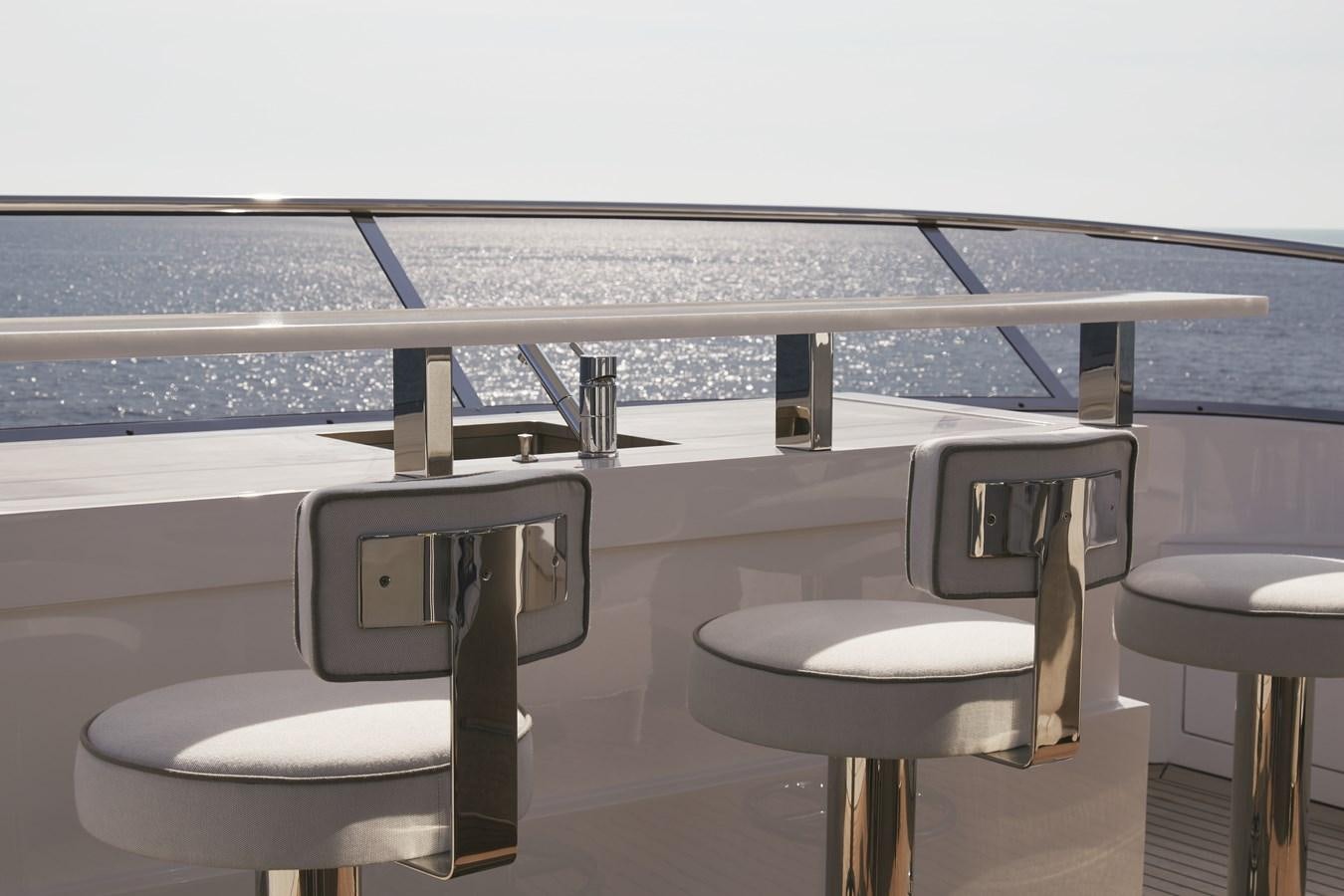 a table with chairs on it aboard BAMBOO Yacht for Sale