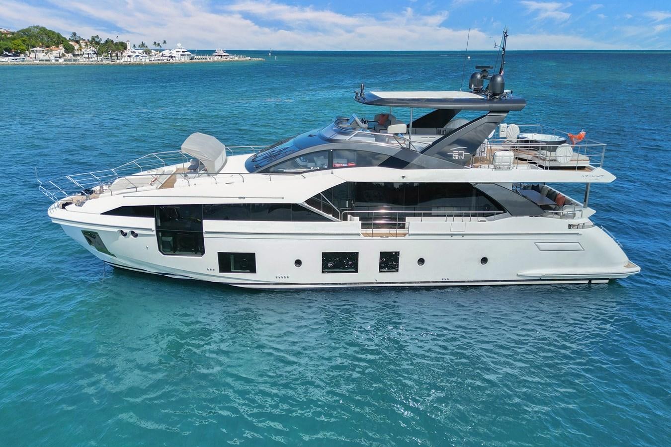 a white yacht in the water aboard ENCHANTE Yacht for Sale