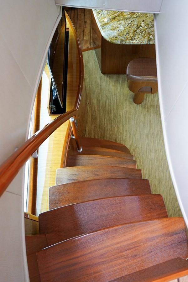 a wooden staircase with a bench aboard BENEDETTA Yacht for Sale