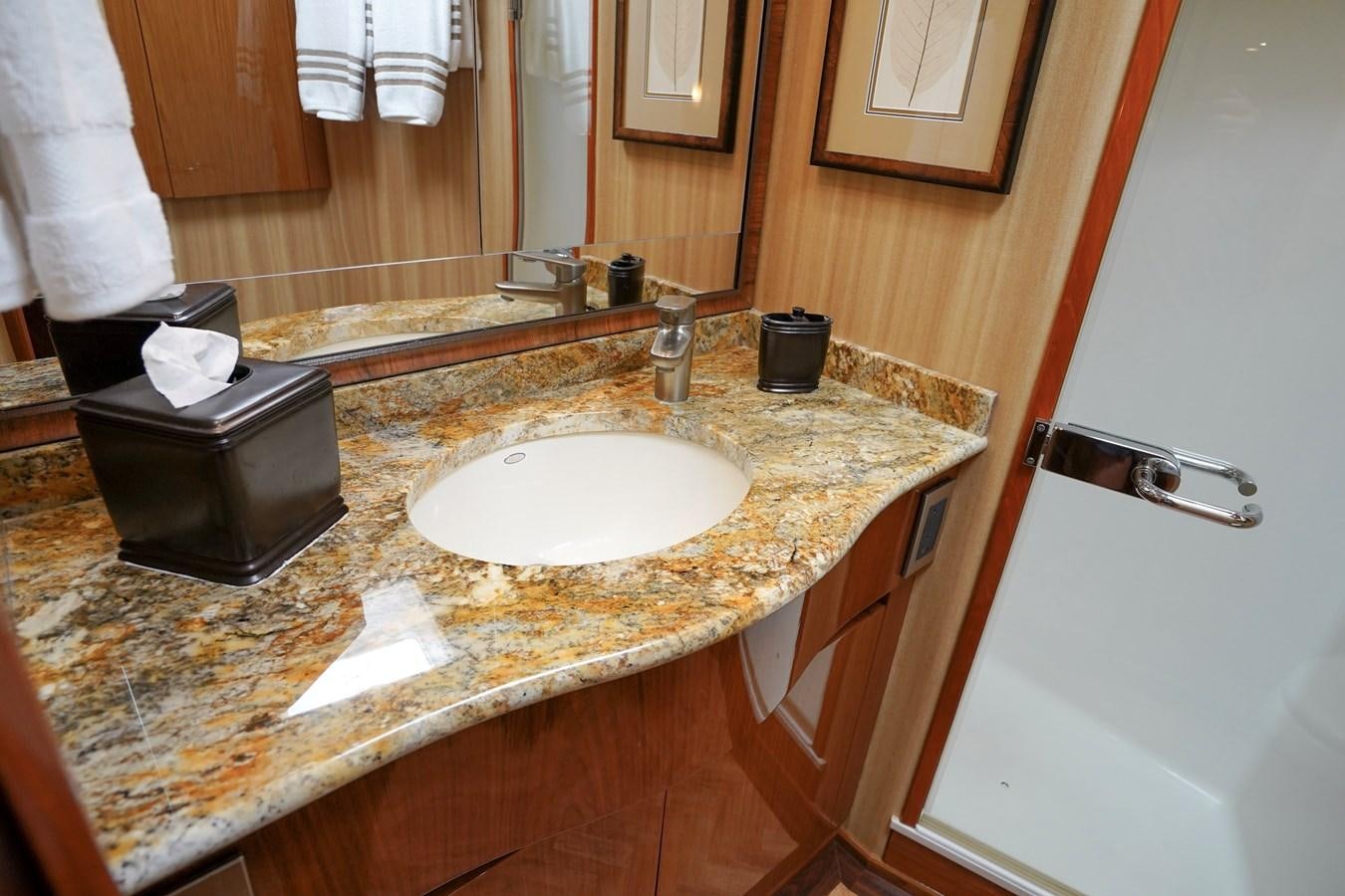 a bathroom with a countertop sink and a black box on the counter aboard BENEDETTA Yacht for Sale