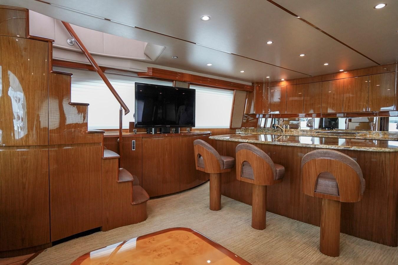 a large kitchen with wooden cabinets aboard BENEDETTA Yacht for Sale