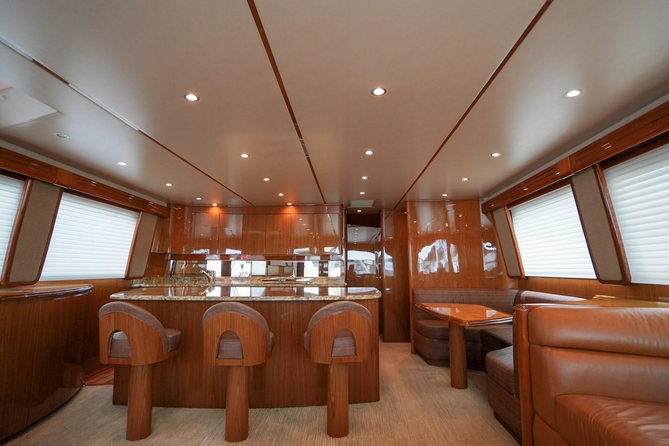 a room with a table and chairs aboard BENEDETTA Yacht for Sale