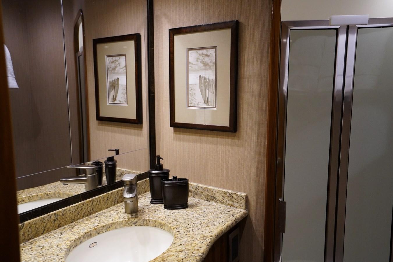 a bathroom with a sink and mirror aboard BENEDETTA Yacht for Sale