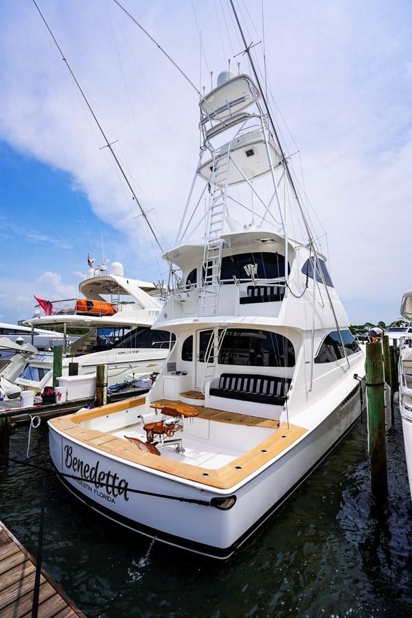 a white boat in a harbor aboard BENEDETTA Yacht for Sale