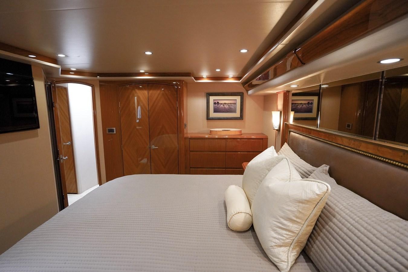 a bed with white sheets aboard BENEDETTA Yacht for Sale