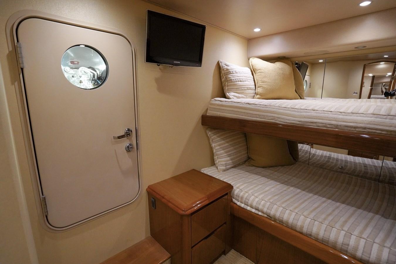 a room with a bed and a tv aboard BENEDETTA Yacht for Sale