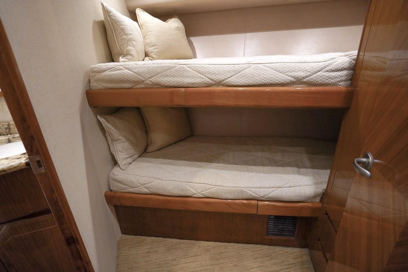 a bed with white sheets aboard BENEDETTA Yacht for Sale