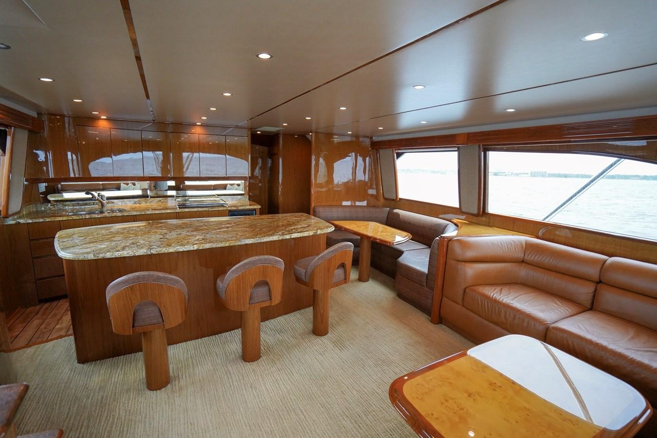 a room with a table and couches aboard BENEDETTA Yacht for Sale