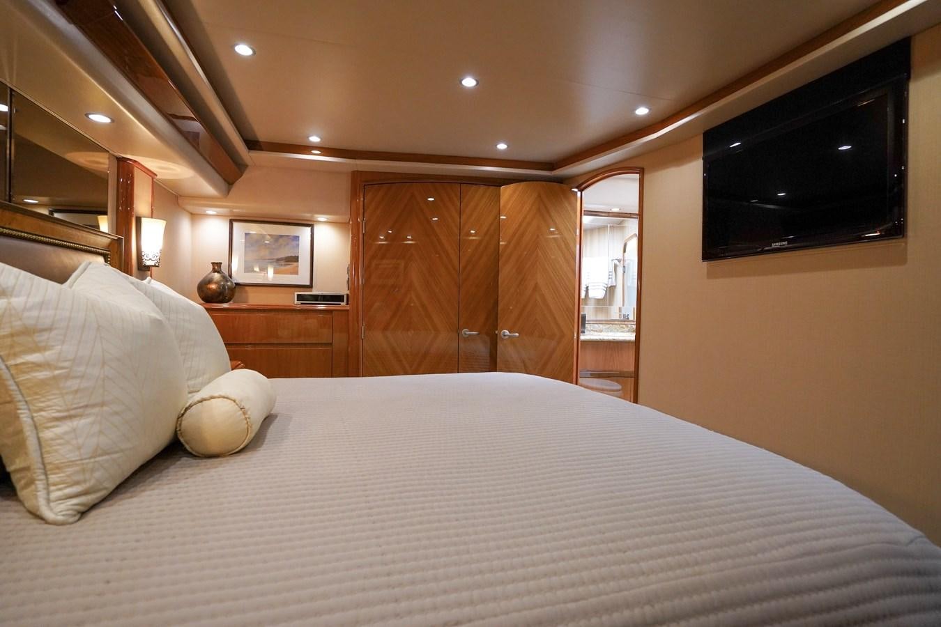 a bed with a white sheet aboard BENEDETTA Yacht for Sale