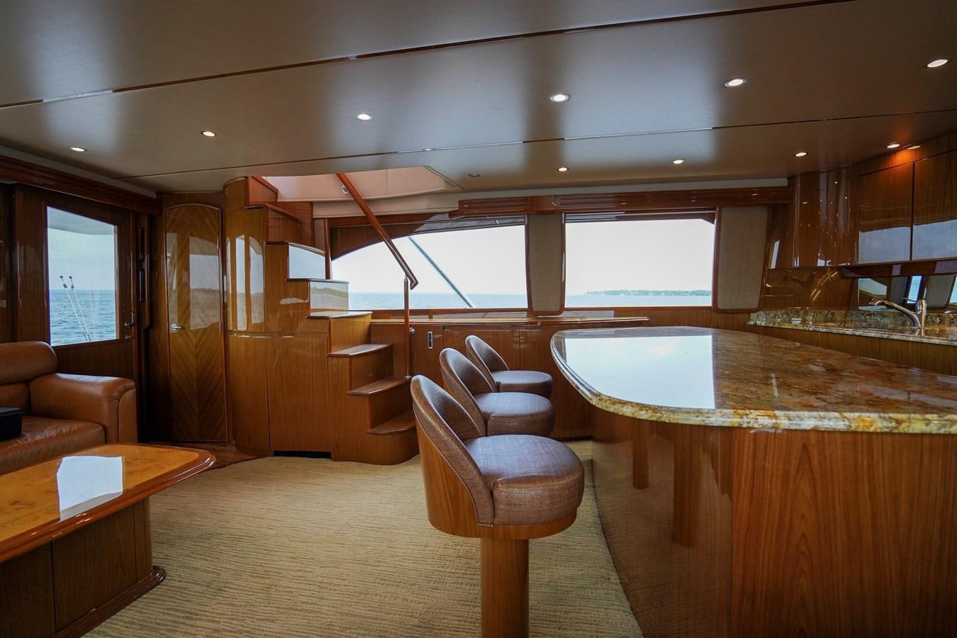 a room with a table and chairs aboard BENEDETTA Yacht for Sale