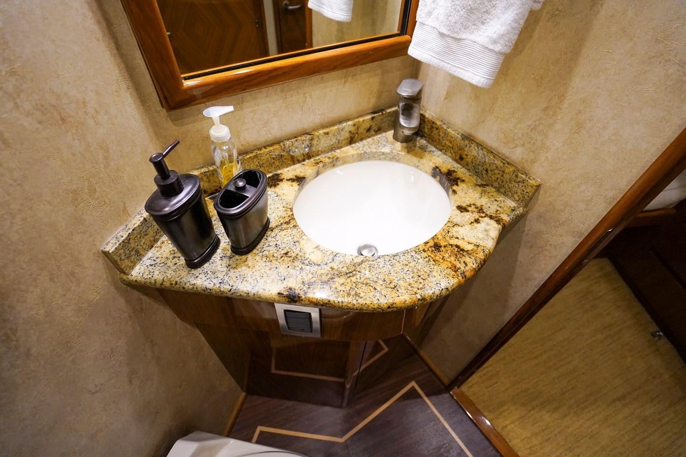 a bathroom sink with a mirror aboard BENEDETTA Yacht for Sale