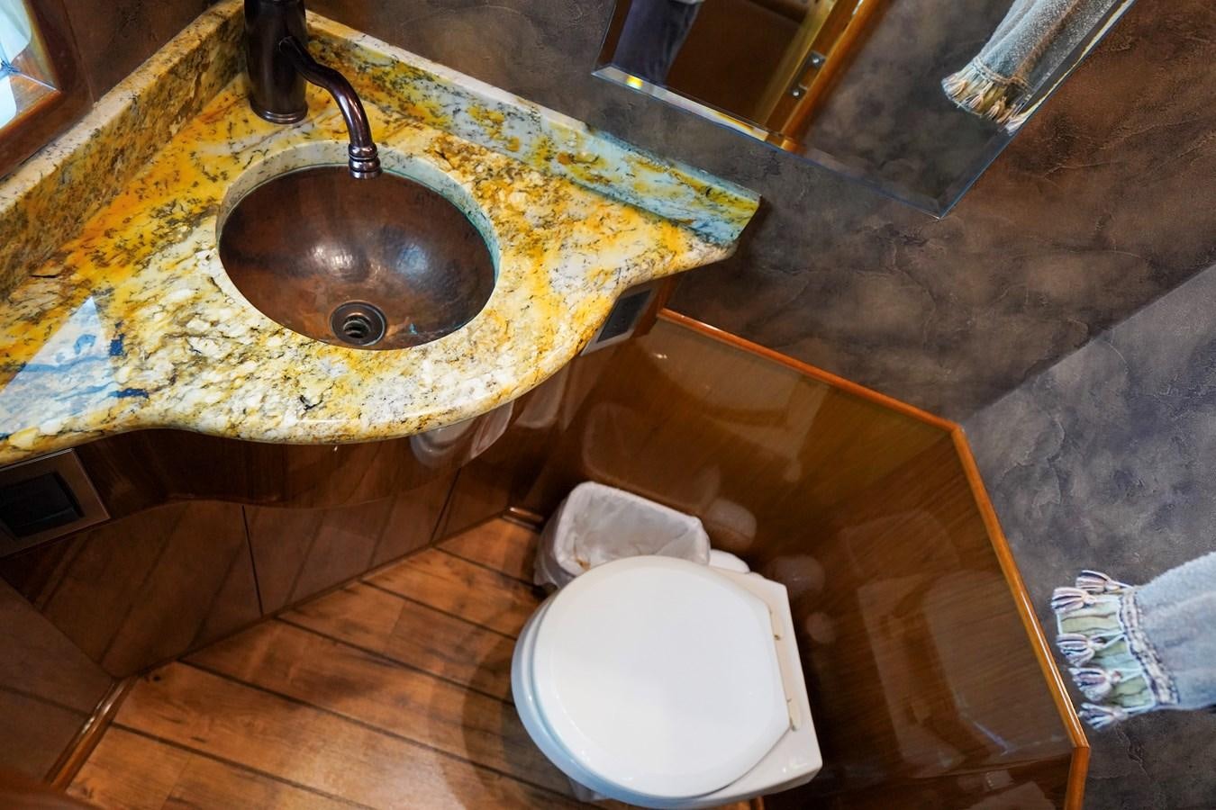 a bathroom with a sink and a toilet aboard BENEDETTA Yacht for Sale