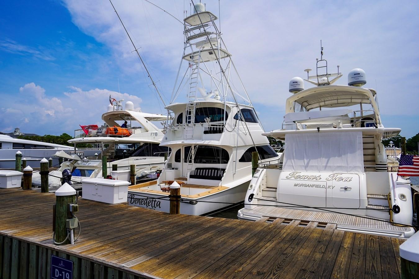 several boats docked at a pier aboard BENEDETTA Yacht for Sale