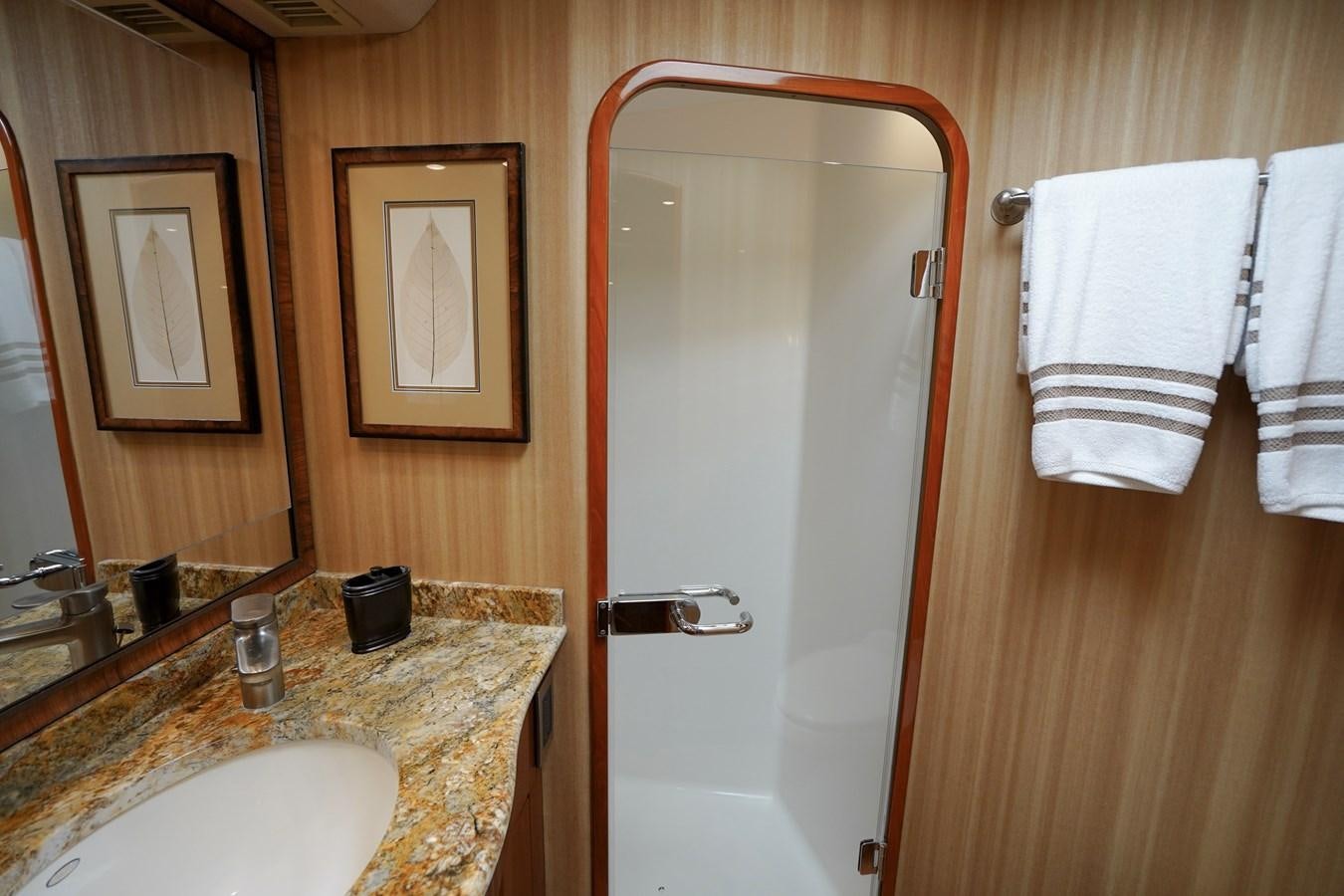 a bathroom with a mirror and a sink aboard BENEDETTA Yacht for Sale