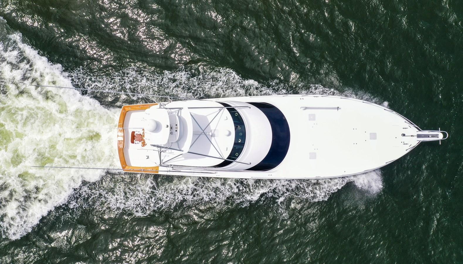 a white and yellow boat on the water aboard BENEDETTA Yacht for Sale