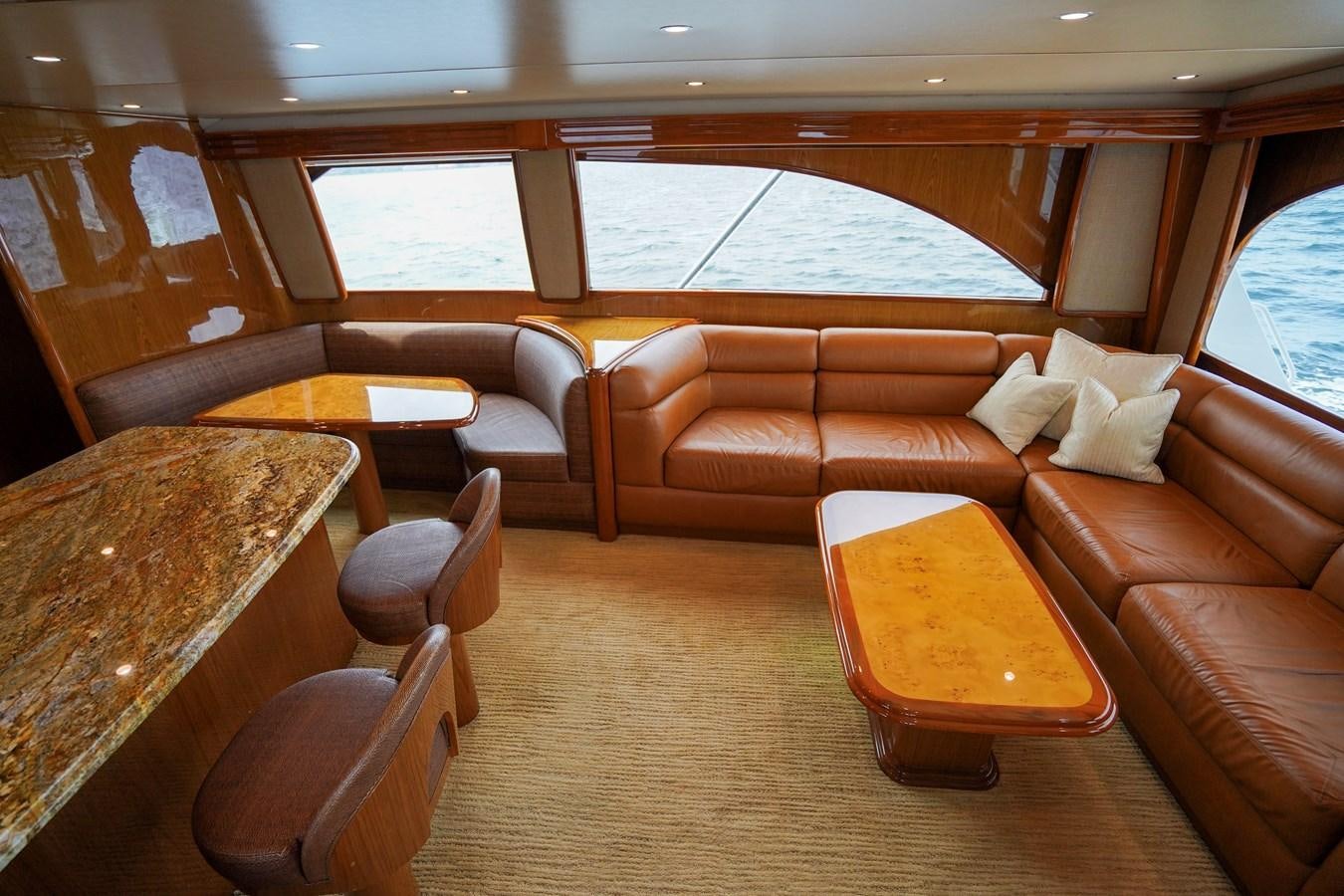 a room with a table and chairs aboard BENEDETTA Yacht for Sale