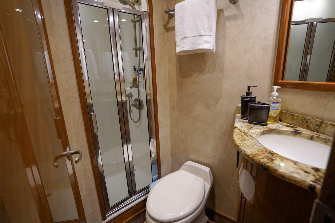 a bathroom with a glass shower door aboard BENEDETTA Yacht for Sale