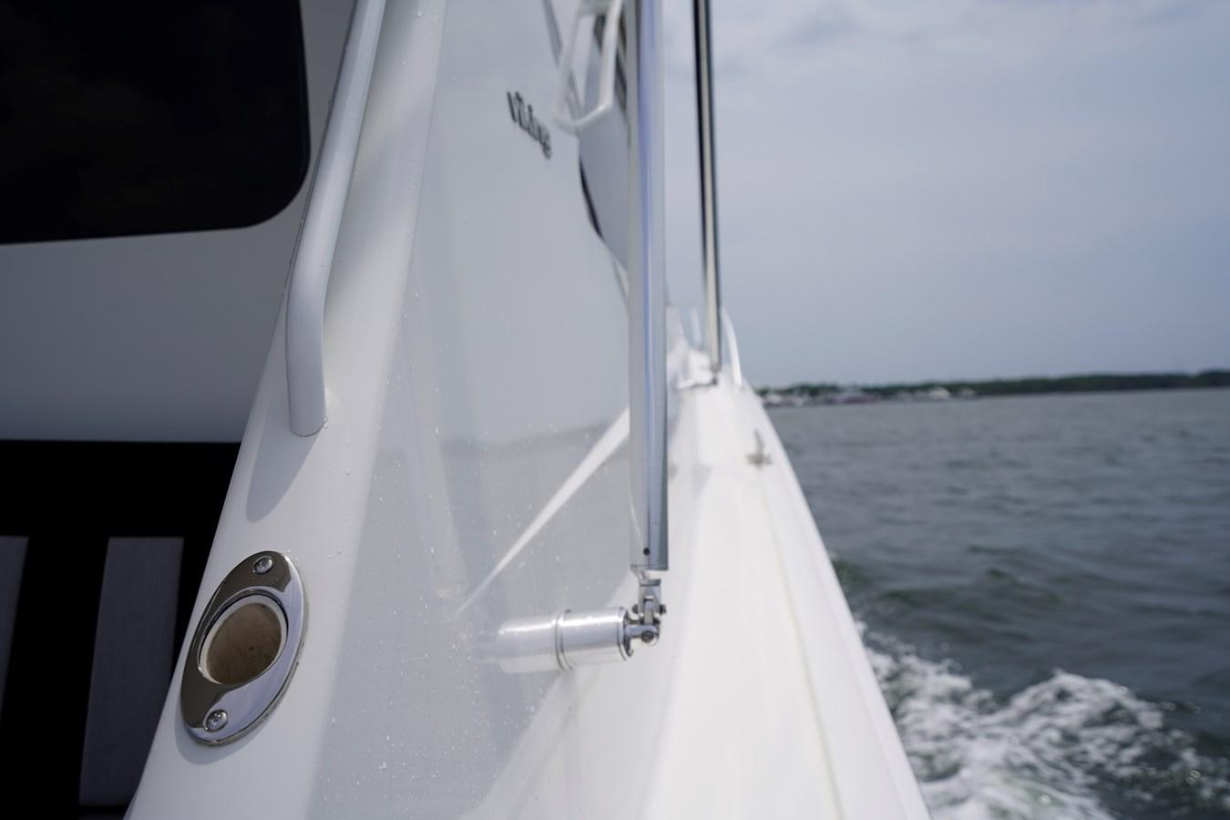 a white boat on the water aboard BENEDETTA Yacht for Sale