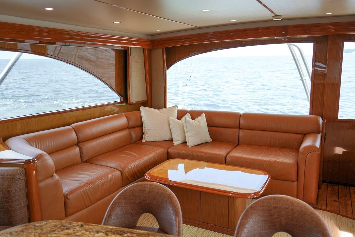 a living room with a couch and a table aboard BENEDETTA Yacht for Sale
