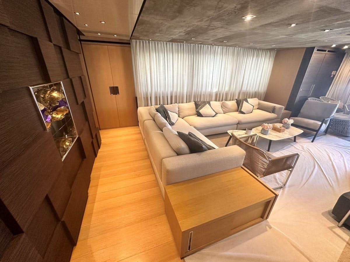 a living room with a couch and a television aboard SL 94' Yacht for Sale