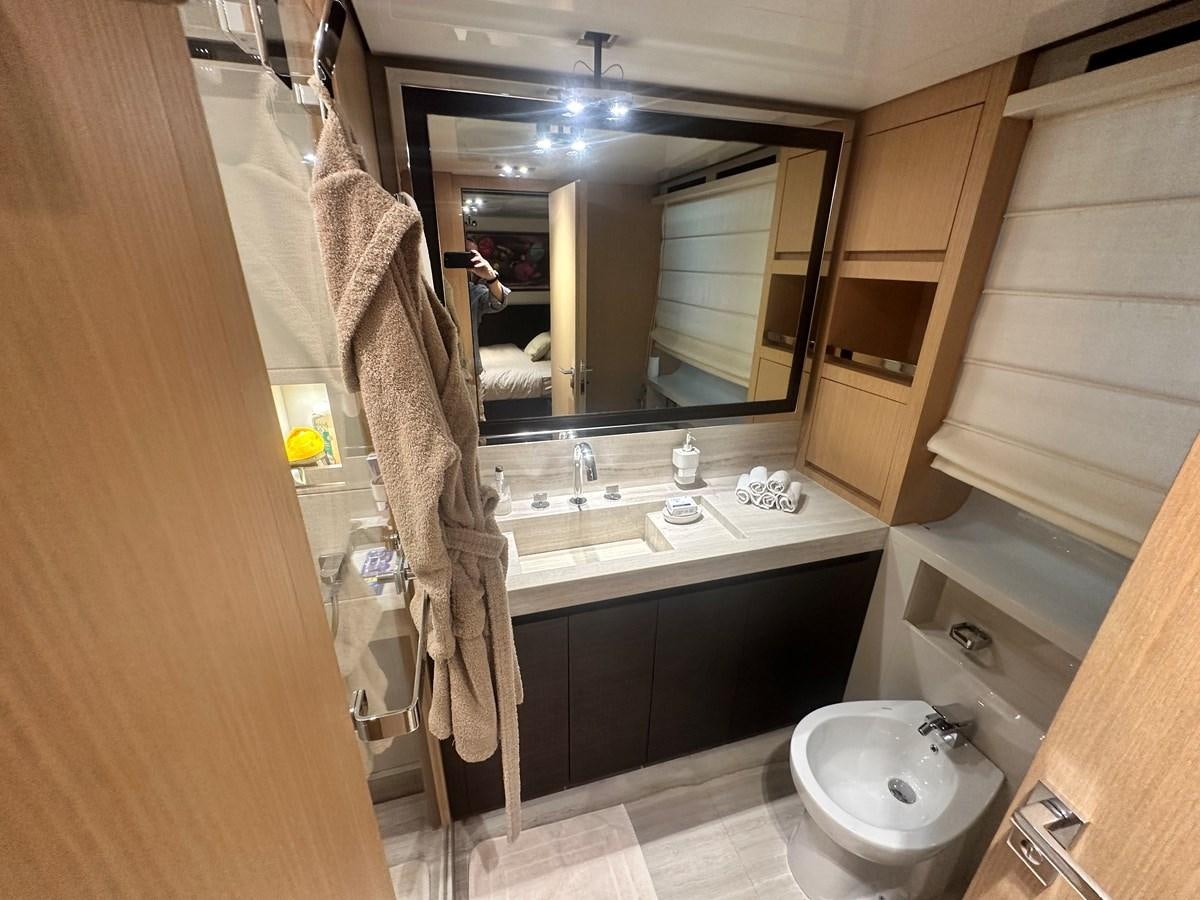 a bathroom with a large mirror aboard SL 94' Yacht for Sale