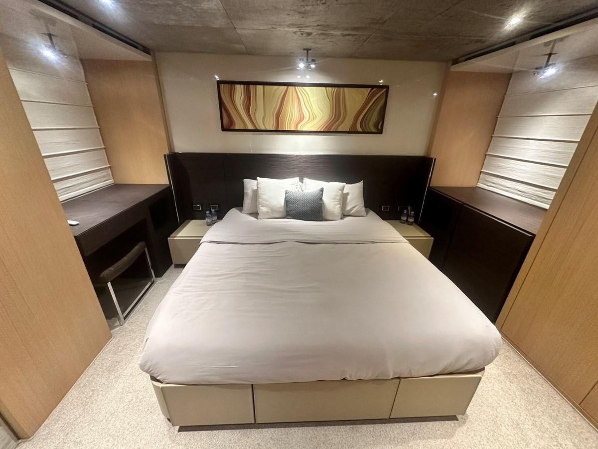 a bed in a room aboard SL 94' Yacht for Sale