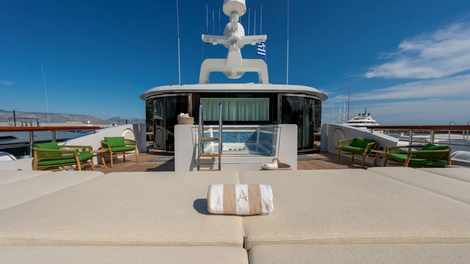 a building with a glass roof and a white statue on top aboard AELIA Yacht for Sale