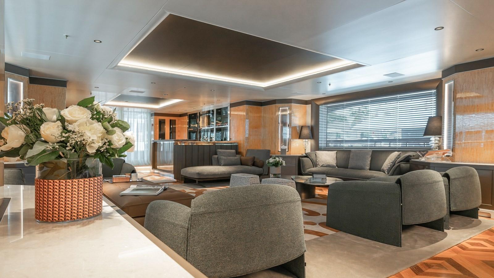 a large living room with a large open floor plan aboard AELIA Yacht for Sale