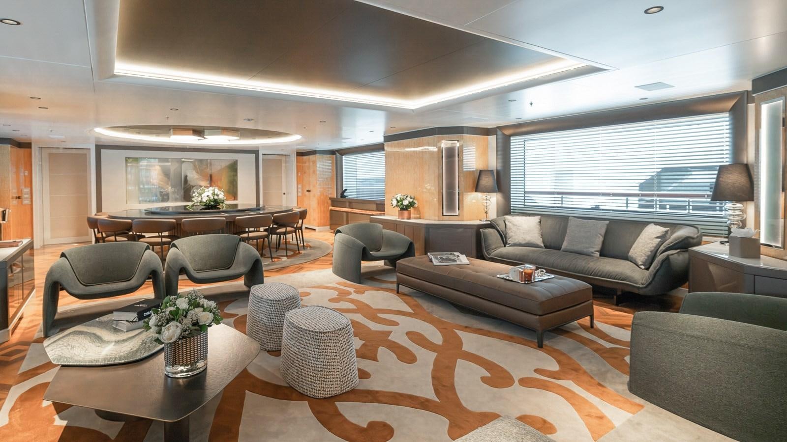 a living room with a large screen aboard AELIA Yacht for Sale