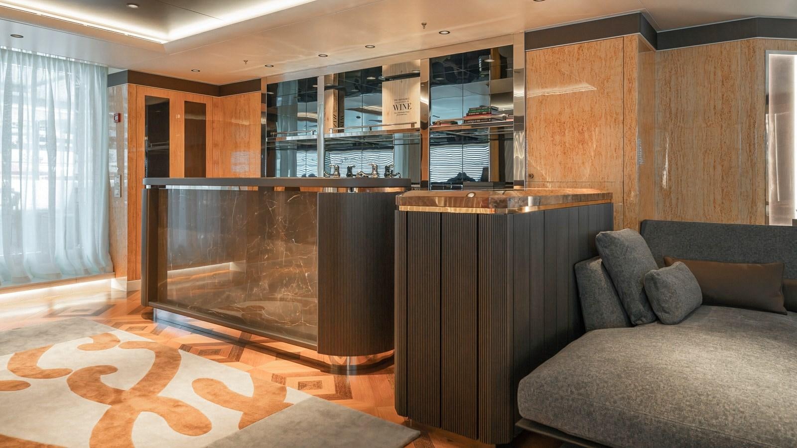 a living room with a fireplace aboard AELIA Yacht for Sale