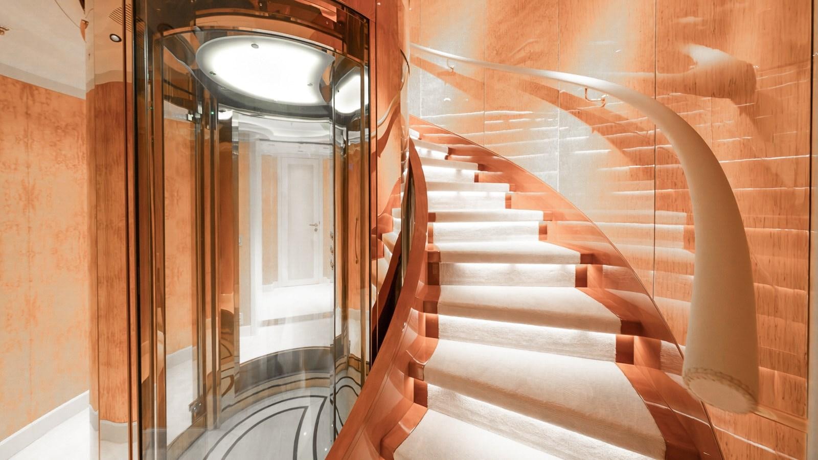 a staircase with a glass door aboard AELIA Yacht for Sale