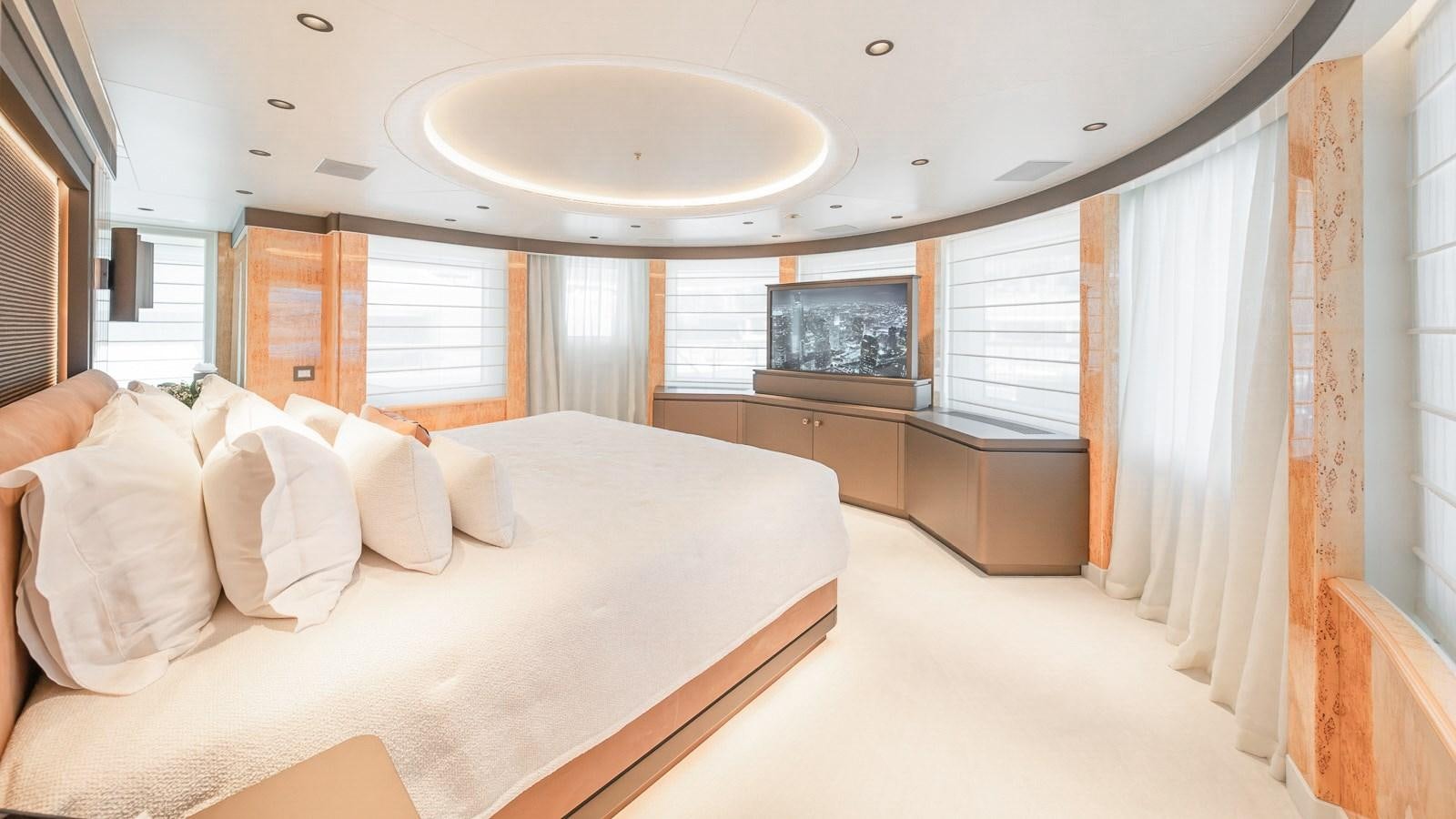 a large bedroom with a large bed aboard AELIA Yacht for Sale
