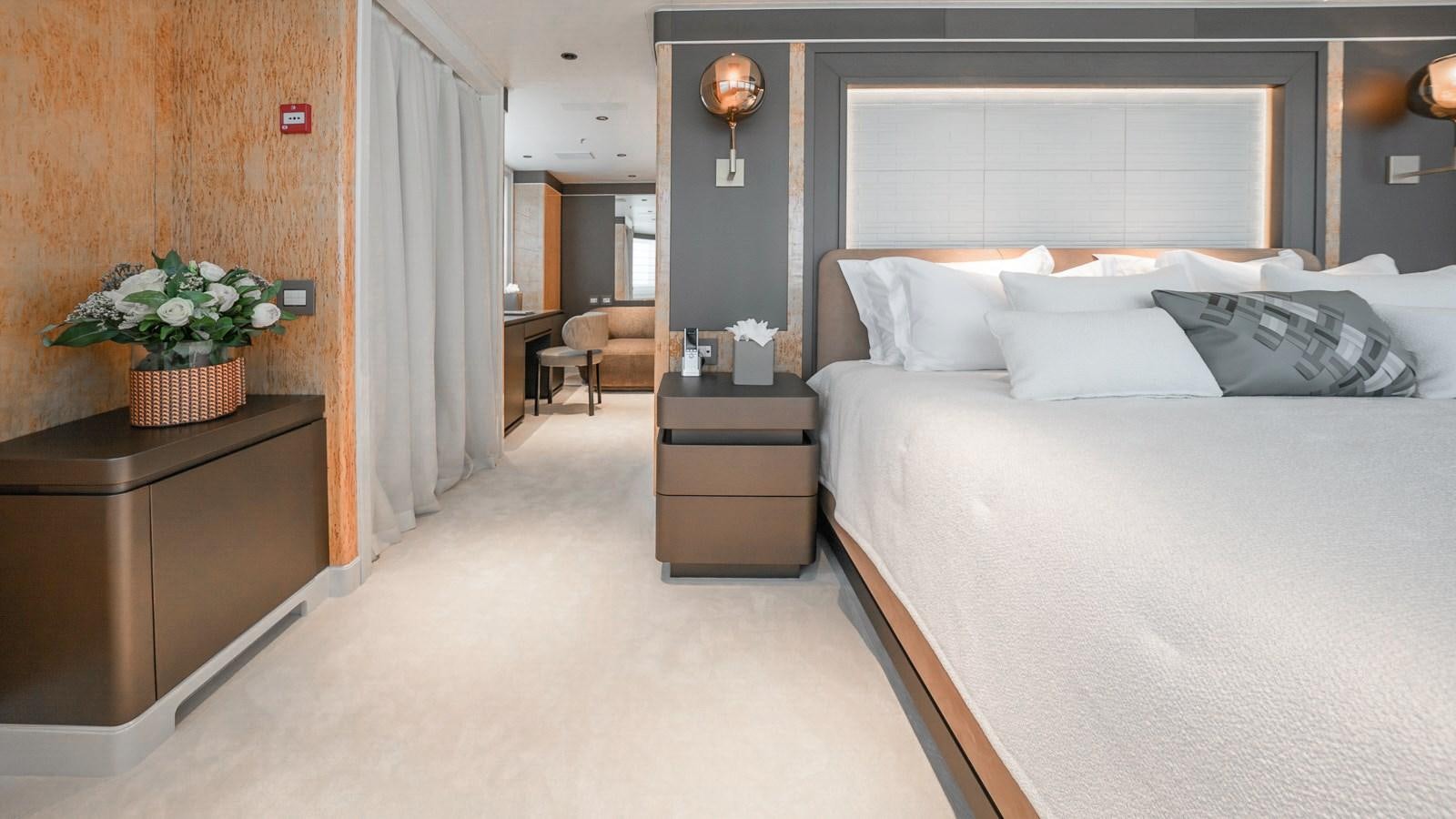 a room with a bed and a table aboard AELIA Yacht for Sale