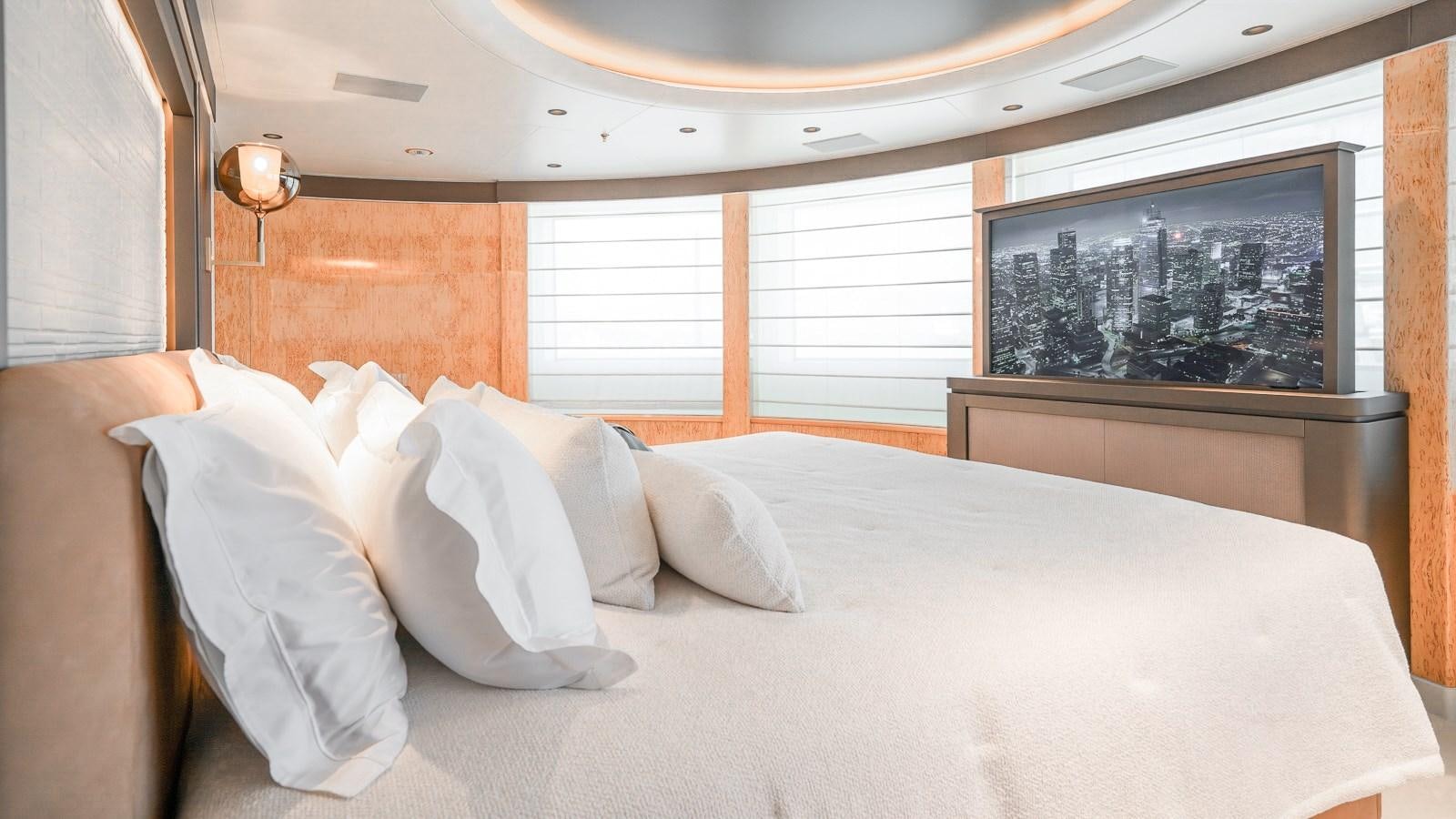 a bed with white pillows aboard AELIA Yacht for Sale