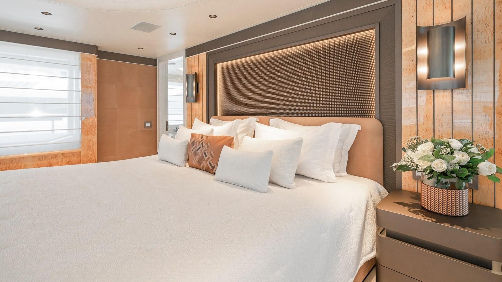 a bed with white sheets and pillows aboard AELIA Yacht for Sale