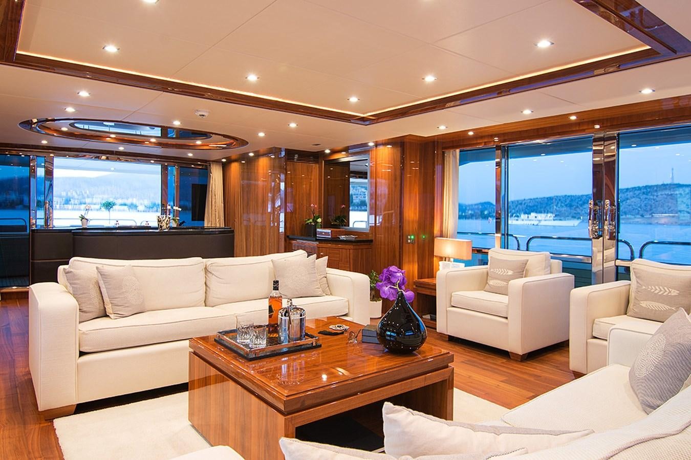 a living room with a large window aboard PATHOS Yacht for Sale
