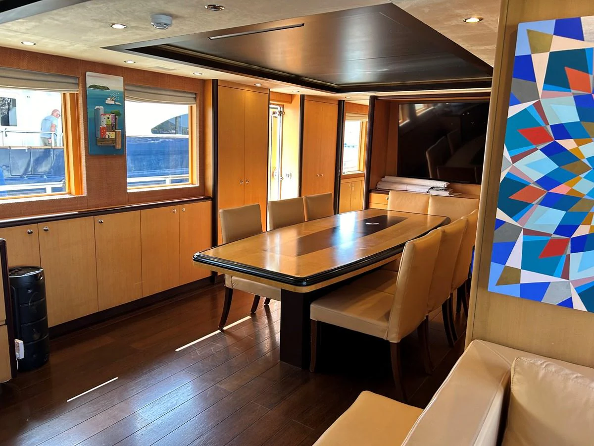 a room with a table and chairs aboard WHISPER Yacht for Sale